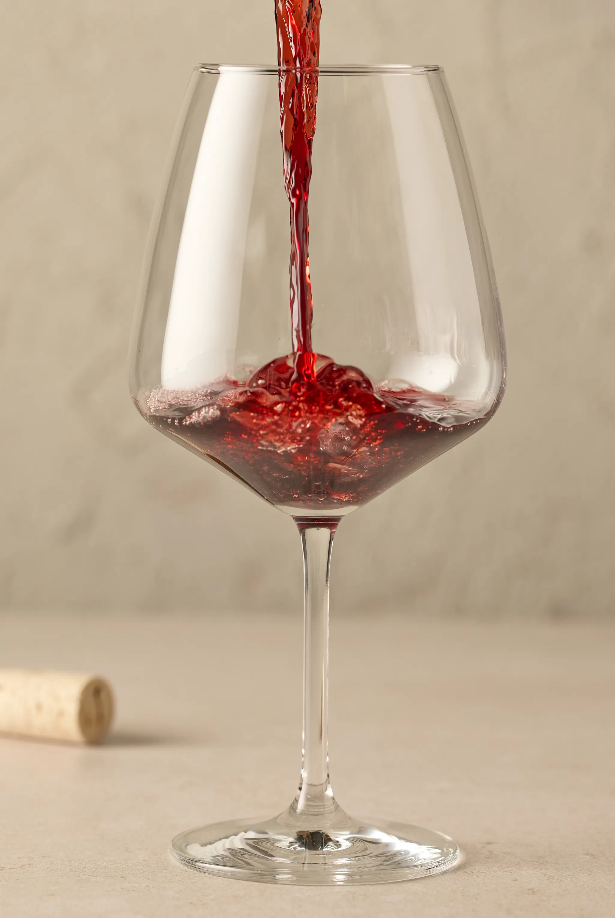 Red wine being poured into a glass